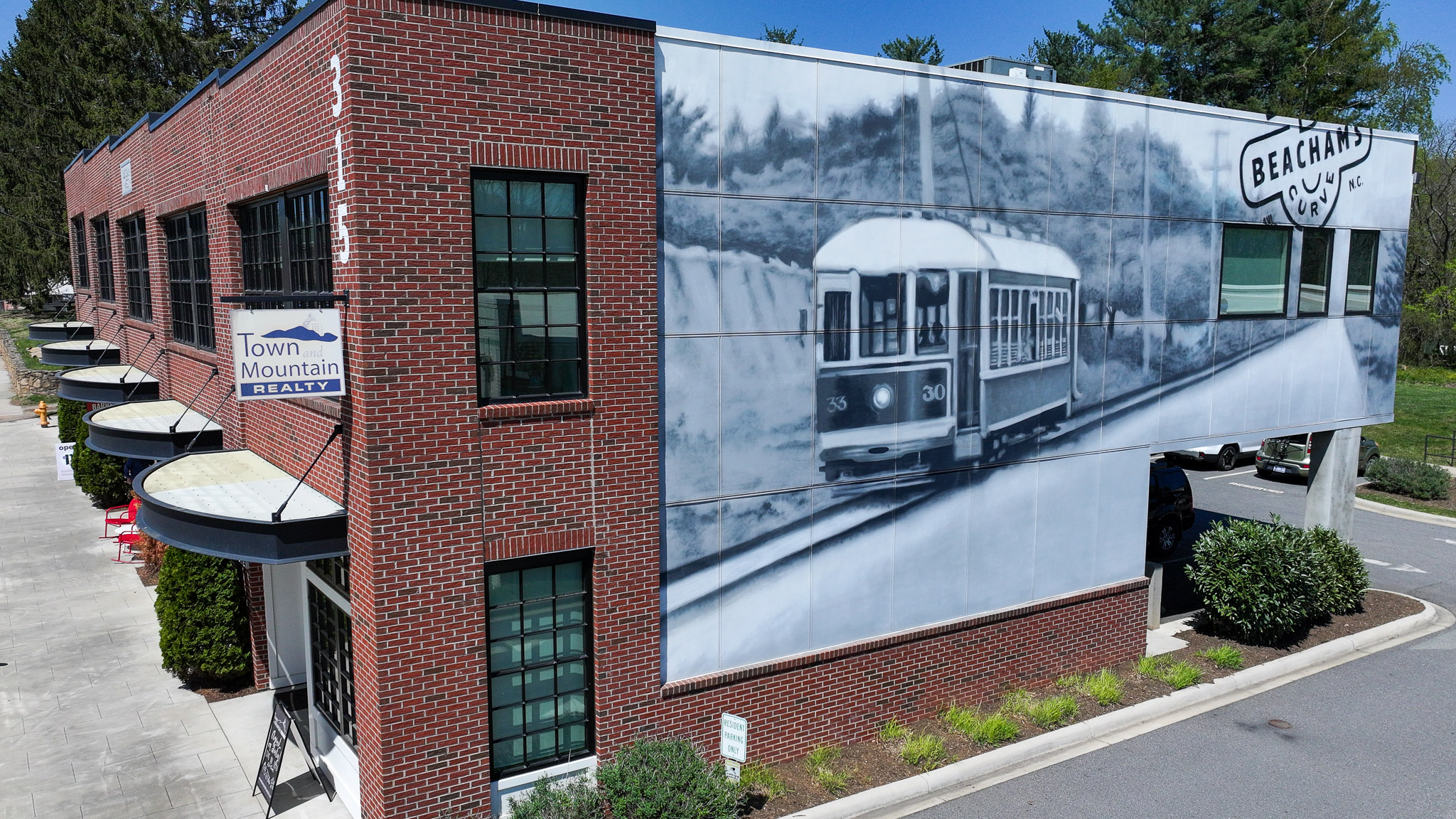 Downtown Asheville NC skyline with Blue Ridge Mountains — real estate
